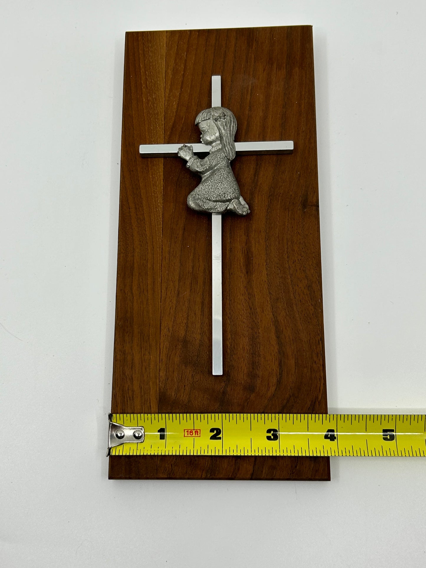 Vintage Girl Child Kneeling and Praying against a Cross