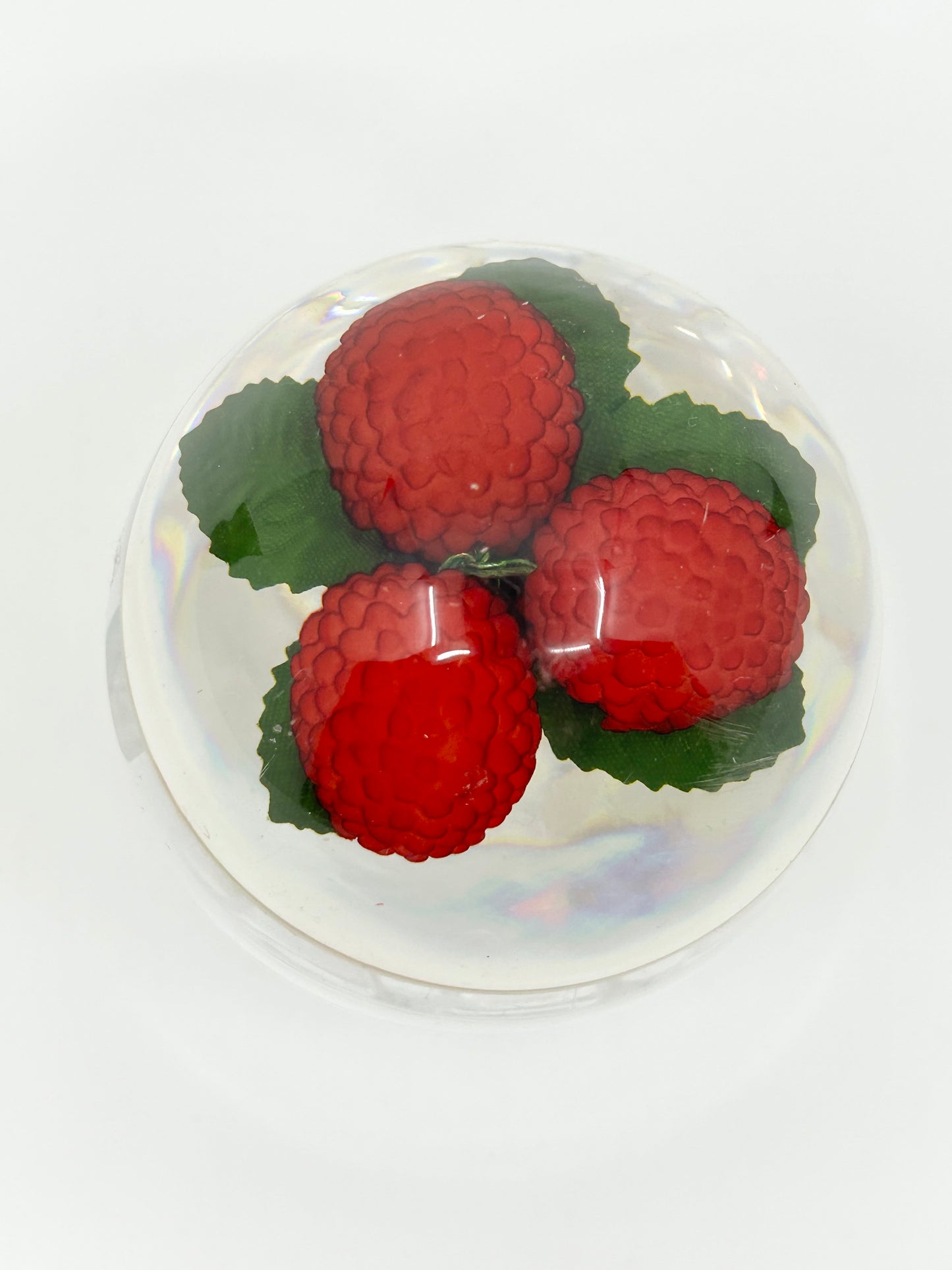 Rasberries encased in an Acrylic Jam Jar